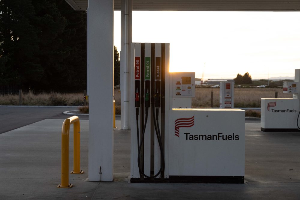 Tasman Fuels forecourt canopy and pumps at sunset